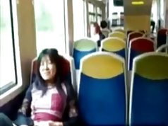 Asian milf rubs her clit on a train.